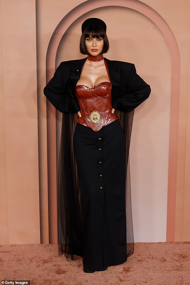 Azza Slimene put on an edgy display as she showed off her curves in a corset and long skirt