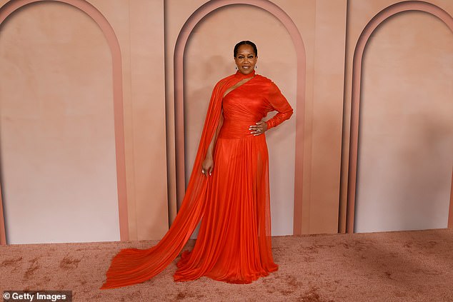 Regina King wowed in a bright red pleated dress with matching cape