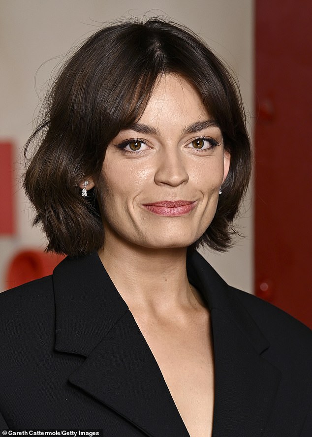 Emma accentuated her dainty features with glam make-up