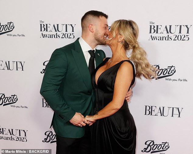 The couple packed on the PDA as they posed for photos