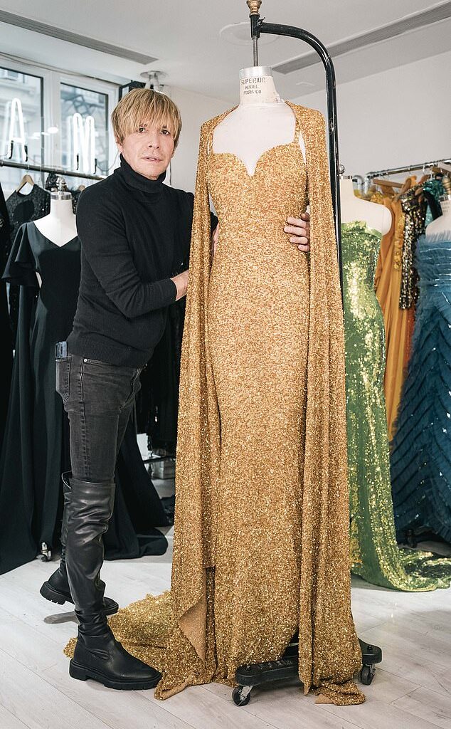 Marc Bouwer, seen with one of his recent designs, made hundreds of ensembles for Whitney Houston and has lifted a lid on what it was really like working with the late singer