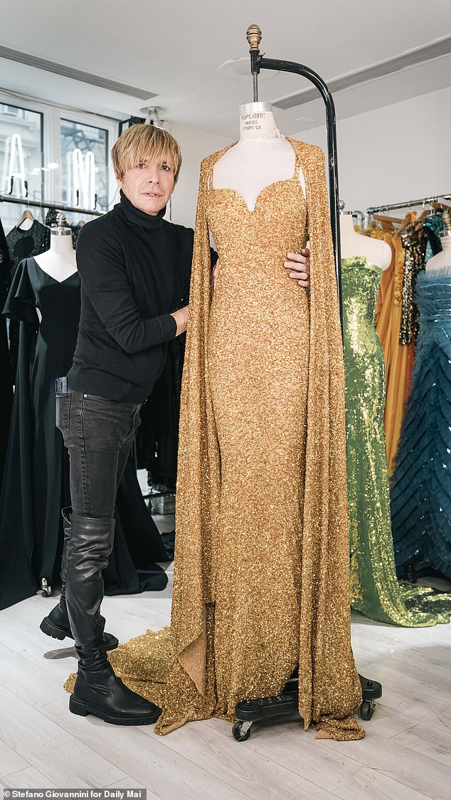 Marc Bouwer, seen with one of his recent designs, made hundreds of ensembles for Whitney Houston and has lifted a lid on what it was really like working with the late singer