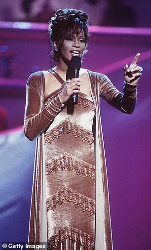 Houston is seen wearing one of his designs in 1996