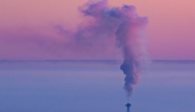 A smokestack with smoke coming out of it