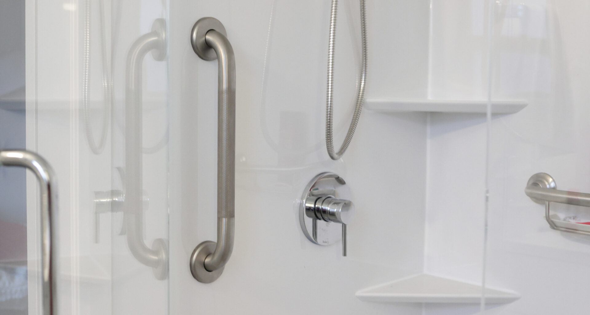 A metal wall bar can help a person reduce falls and maintain balance when entering or leaving a shower stall.