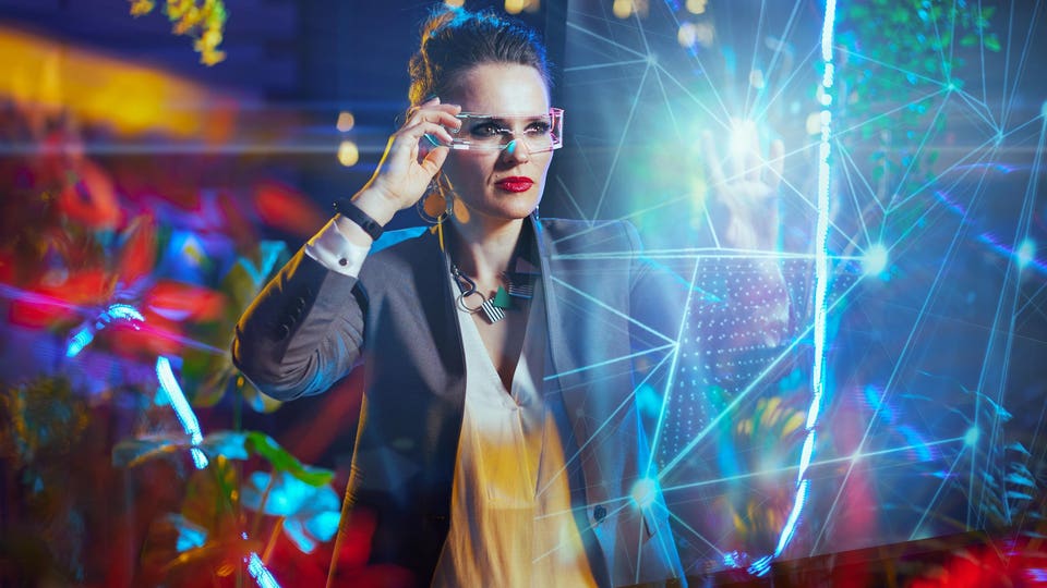 Focused professional woman interacting with AI vibe coding innovation colorful screen