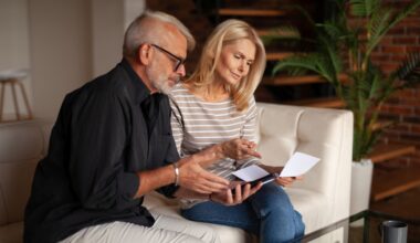 The older couple looks at the bill in confusion from an unexpected expense.
