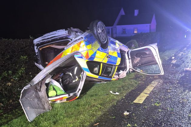 Investigation under way as garda patrol car crashes and flips onto roof en route to burglary call