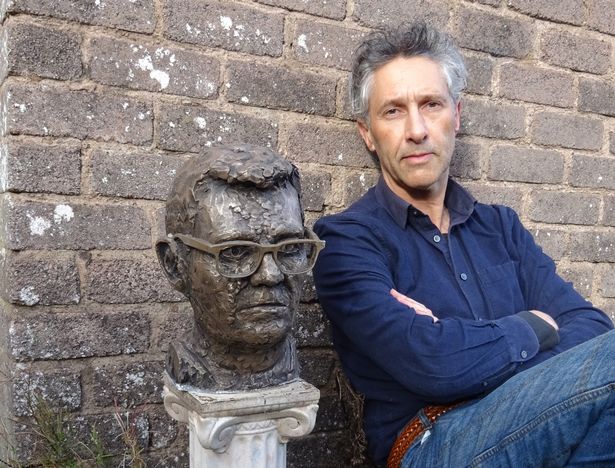 Artist Anthony D Padgett with his artwork. 