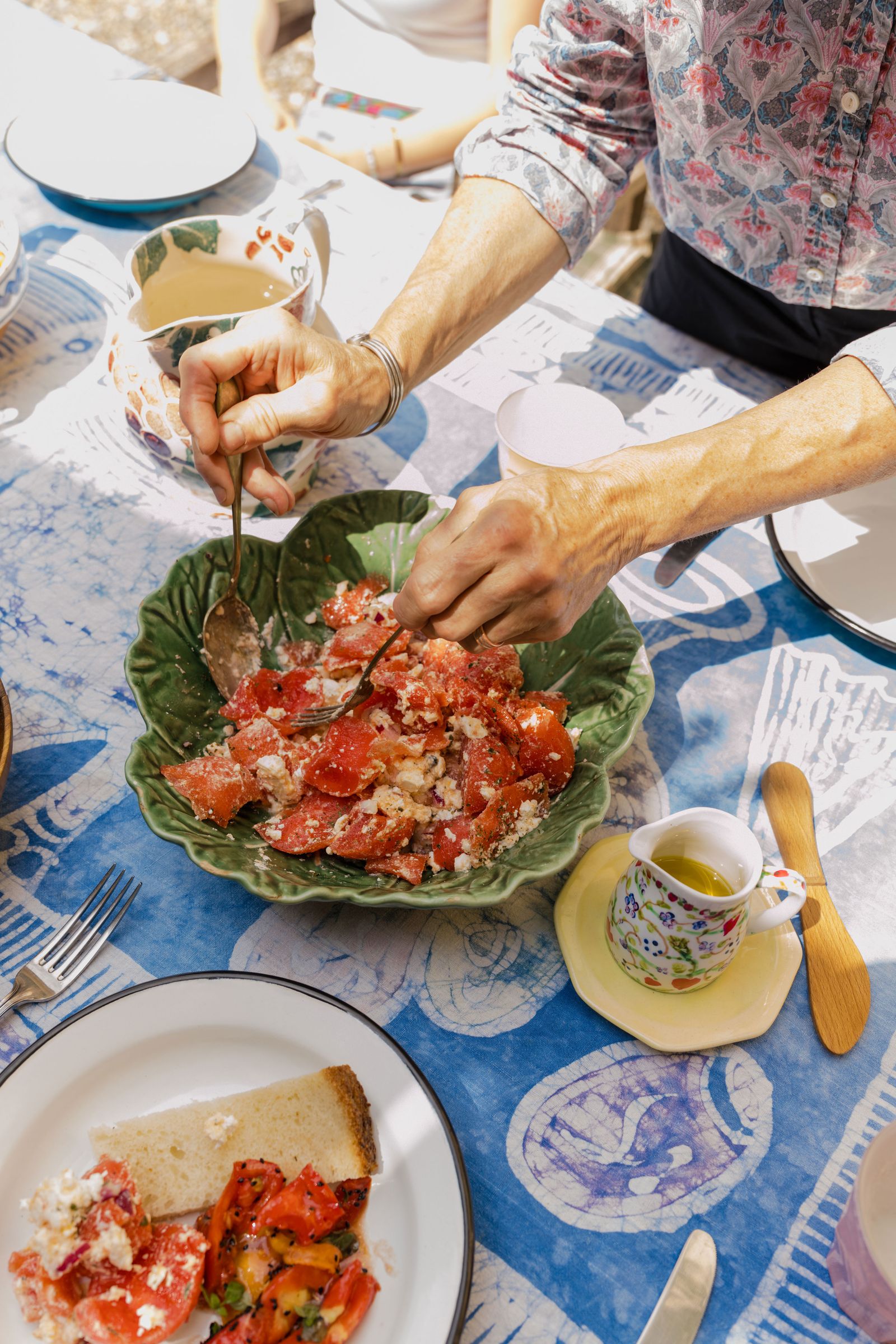 Image may contain Food Food Presentation Cup Adult Person Cooking Brunch Bread Cutlery and Fork