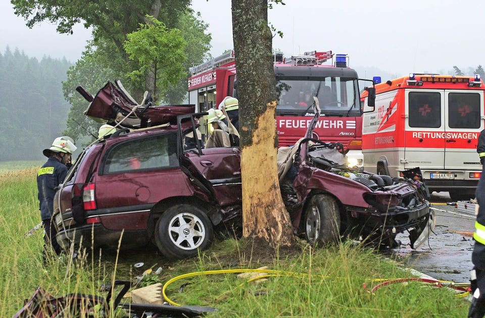 A photo of a crash crashing into a tree.