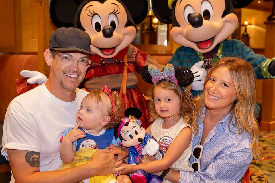 Christian Thompson/Disneyland Resort via Getty Ashley Tisdale French with her husband Christopher and their two daughters Jupiter and Emerson