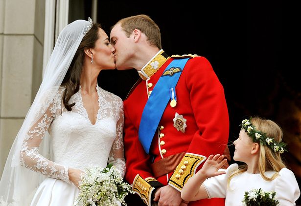 Prince William, Duke of Cambridge and Catherine, Duchess of Cambridge kiss on the balcony of Buckingham Palace after getting married on April 29, 2011