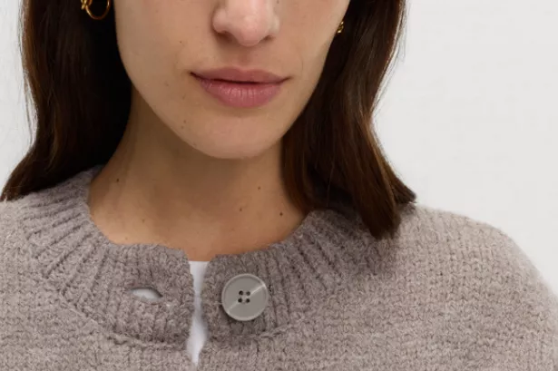 a woman in a cardigan