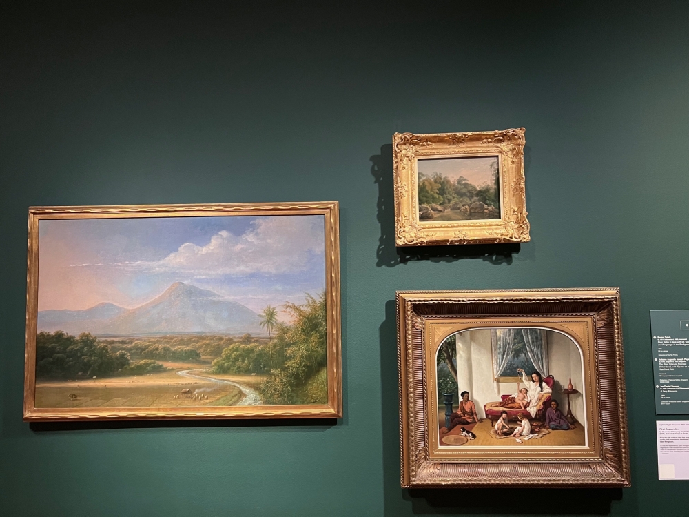 (Left) River Valley in Java with Mt Gee and Pangrango in the Background, (top right) The River Citarum, Priangan (West Java), with Figures on a Tree-Trunk Raft by Antoine Auguste Joseph Payen and (bottom right) A Lazy Afternoon by Jan Daniel Beynon. These three paintings reflect the artistic connections that merged between Indonesia and Europe in the 19th century. — Picture by Opalyn Mok