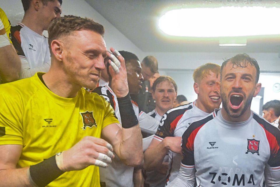 Dundalk players and staff celebrate in the dressing room after winning the SSE Airtricity First Division. The club's kit supplier Playr-Fit is chasing an alleged unpaid debt from the Louth club.
