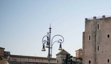 Rescuers try to reach worker trapped in medieval tower that partially collapsed in Rome