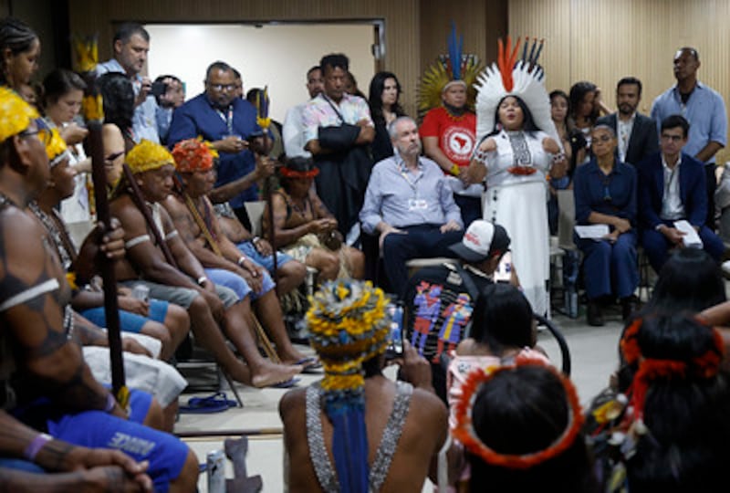 The president of Cop30, André Correa do Lago (centre) listens as Sonia Guajajara, minister of indigenous peoples of Brazil (in white), speaks at a meeting with indigenous peoples at Cop30. Photograph: Hermes Caruzo/Cop30