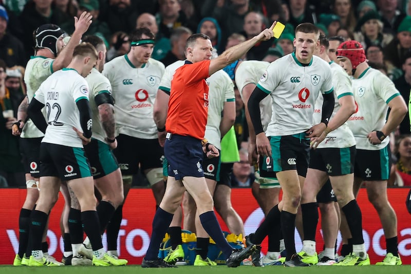Referee Matthew Carley awards Ireland's Sam Prendergast a yellow card during the match against South Africa. Photograph: Gary Carr/Inpho