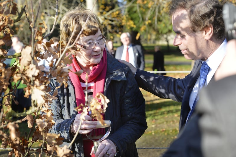 Alice Cairns, mother of Philip Cairns, in 2013 with then minister for justice Alan Shatter planting a tree in the grounds of Farmleigh during a ceremony to mark Missing Persons Day. Photograph: Alan Betson