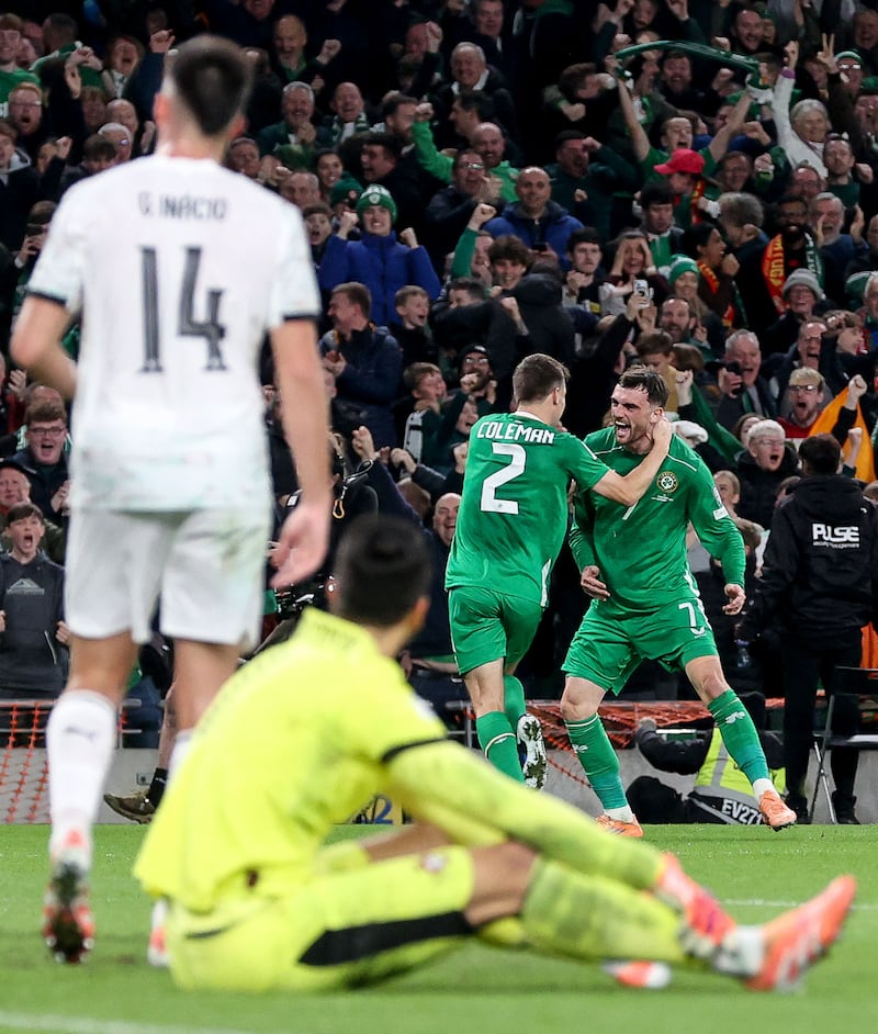 Troy Parrott celebrates with Séamus Coleman after scoring Ireland's second goal. Photograph: Nick Elliott/Inpho