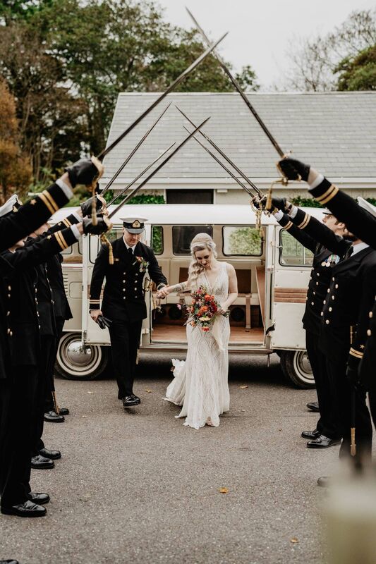 Clara Donnelly and Dmytro Bykovskyy receive a guard of honour from Dmytro's Irish Navy colleagues. Pictures: Black Diamond Photography 