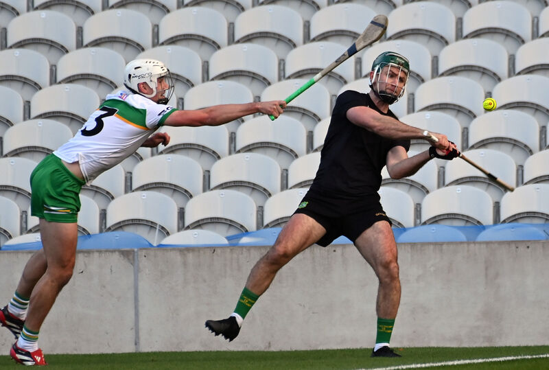 Castlelyons' Anthony Spillane gets his shot away despite pressure from Eoin Roche. Picture: Eddie O'Hare