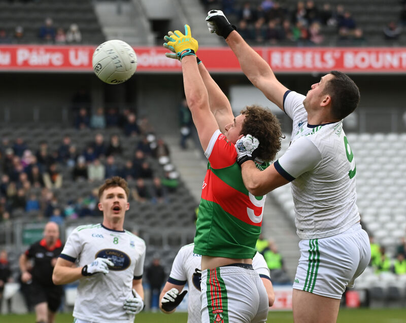 Ballinora's James Lordan and Ilen Rovers' Peadar O'Driscoll go high for the ball. Pic: Eddie O'Hare