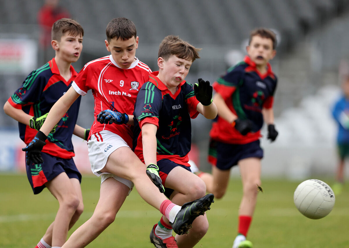 James Kellehetr, Inch, in action against Finnie Conway, Ballinora during the DF2 final. Pic: Jim Coughlan.