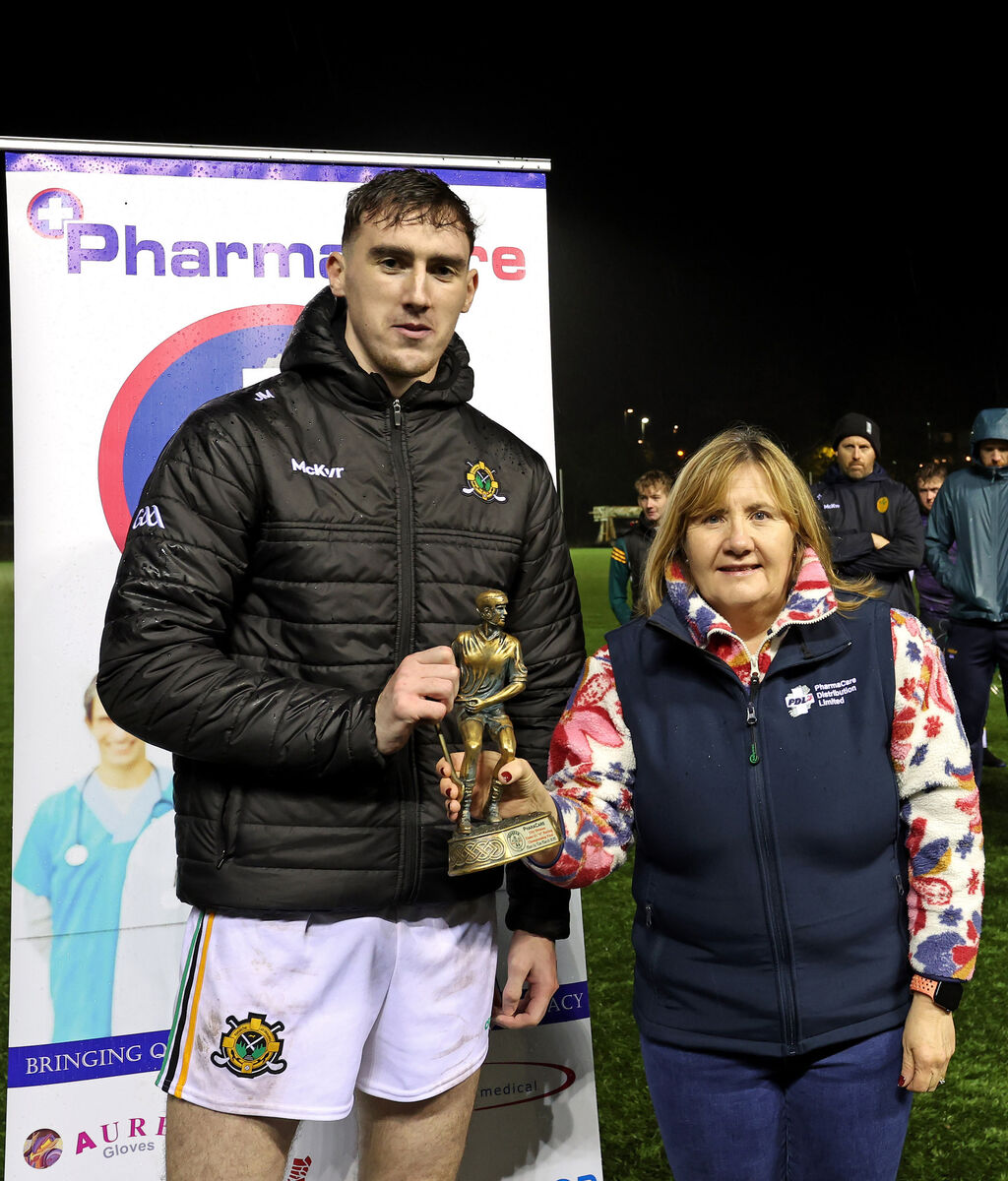  Eoin O'Leary, Glen Rovers, receives the Player of the Match from Liz Farr, Pharmacare. Picture: Jim Coughlan.
