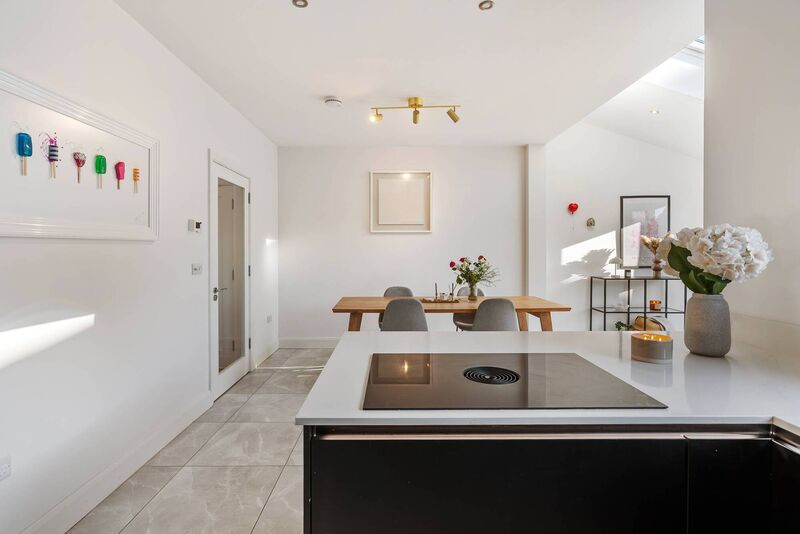 Lots of lolly....colourful lollipops framed as an art work....and one of the owners is  a dentist??