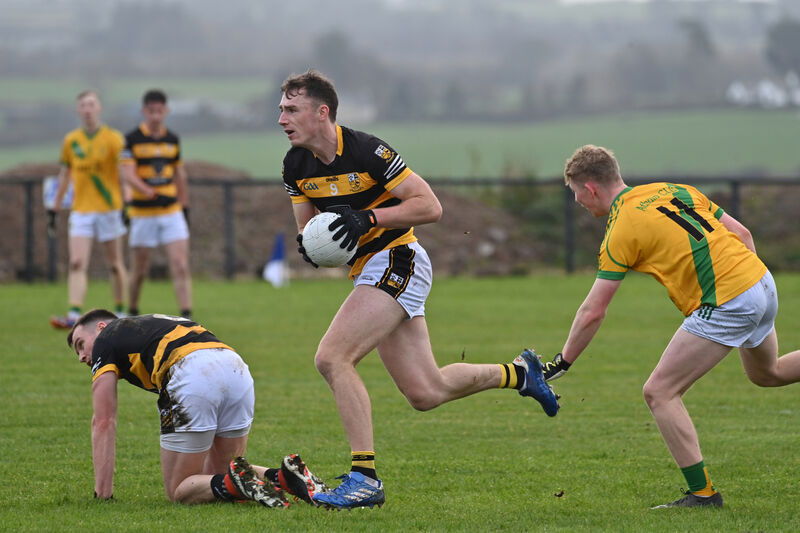 Kevin Lenahan, Buttevant, bursting past Liam Óg Glynn, Ahane. Picture: Dan Linehan