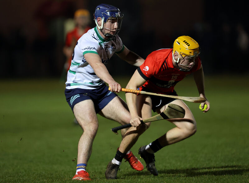  Peter McGarry, UCC, gets away from Chris Thomas, UL. Picture: Jim Coughlan.