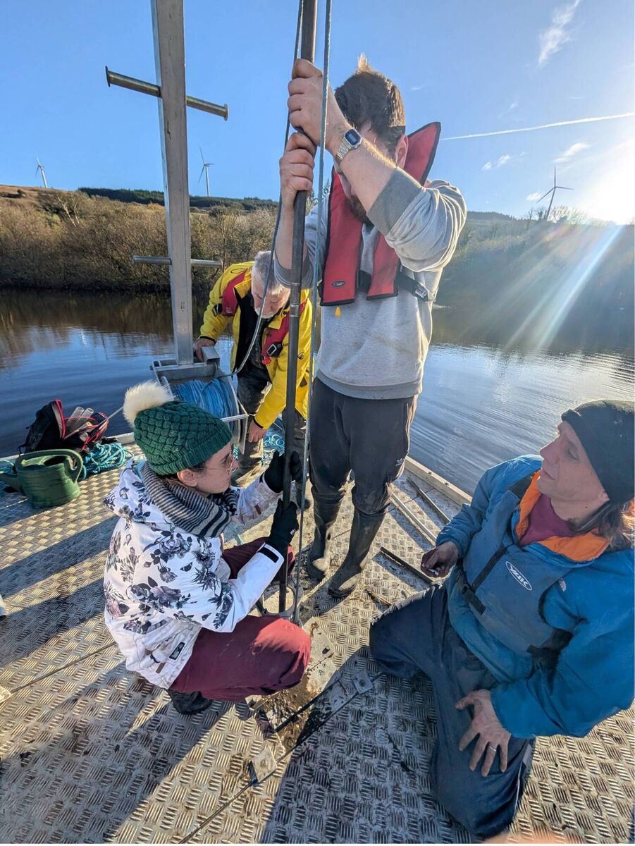 Robin Lewando and Dr Michelle McKeown (University College Cork), Dr Aaron Potito (University of Galway), and Dr Andrew Tighe (University College Dublin) collecting the sediment core at Three Lakes, County Cork. Picture: Sarah Jane Power (University College Dublin)