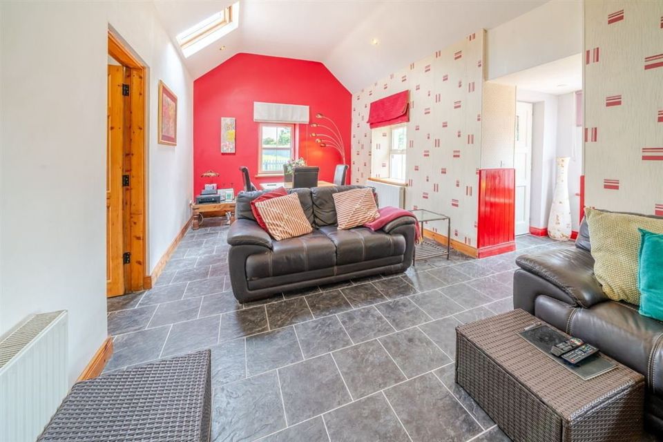 The cottage was recently renovated and features an open-plan kitchen, dining and living area. Photo: DNG Cyril Burke.