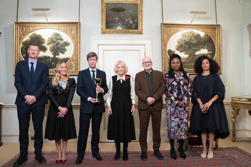 Britain's Queen Camilla (centre) with David Szalay (third left) and (left to right) Chris Power, Sarah Jessica Parker, Ayòbámi Adébáyò and Kiley Reid at a reception in Clarence House, London, this week. Photograph: Stefan Rousseau/Pool/AFP via Getty Images         