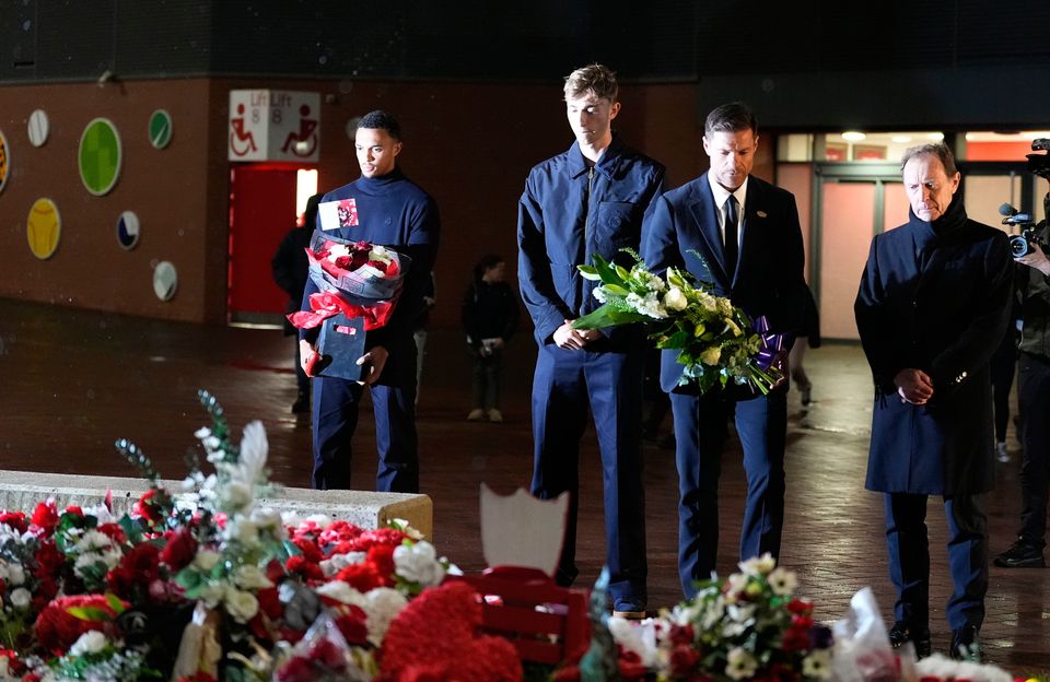 Real Madrid's manager Xabi Alonso (second right) lays a tribute at the Diogo Jota memorial outside Anfield