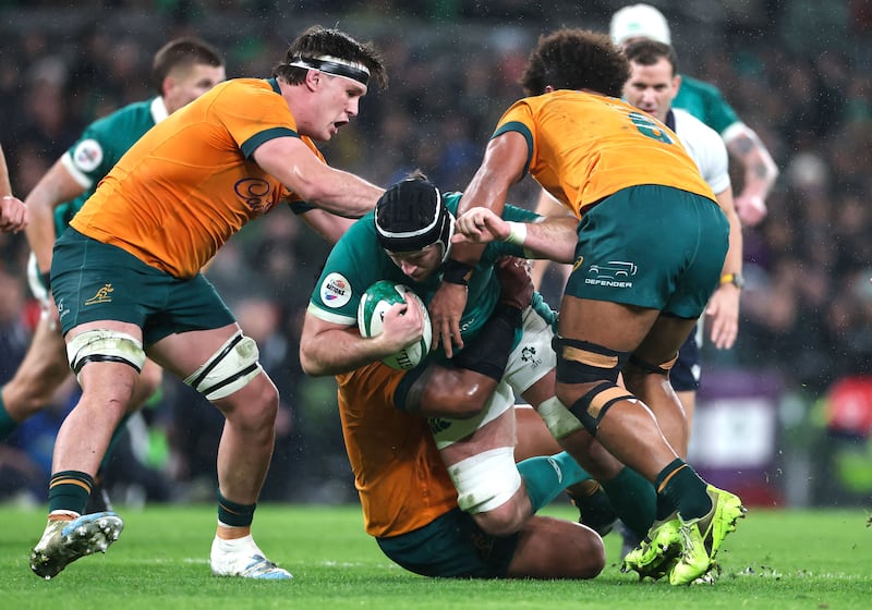 Ireland’s Caelan Dorris is tackled by Australia’s Rob Valetini. Photograph: Nick Elliott/Inpho
