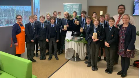 Monmouthshire County Council Pupils from Haberdashers’ Monmouth School and Monmouth Comprehensive, at County Hall in Usk, following a presentation urging councillors to do more to remove goods associated with deforestation from school meals.  