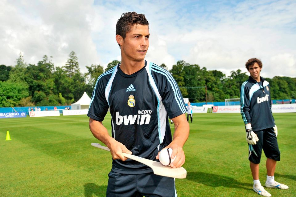 Real Madrid's Cristiano Ronaldo practices his hurling skills during a special training session ahead of making his debut for the Spanish giants against Shamrock Rovers in 2009. Photo: David Maher/Sportsfile