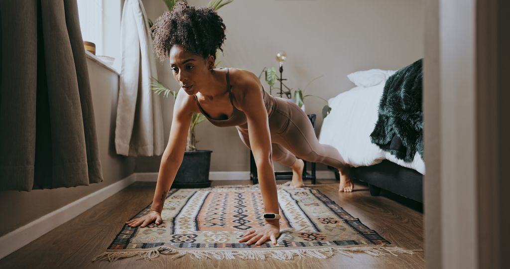 Fitness, black woman and push up exercise in home for wellness, healthy lifestyle and workout 
