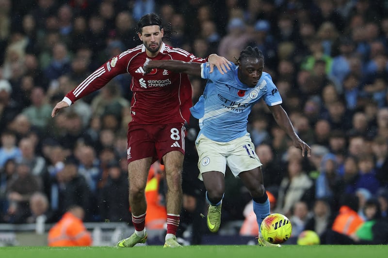 Dominik Szoboszlai challenges Jérémy Doku at the Etihad Stadium on Sunday. Photograph: Darren Staples/Getty