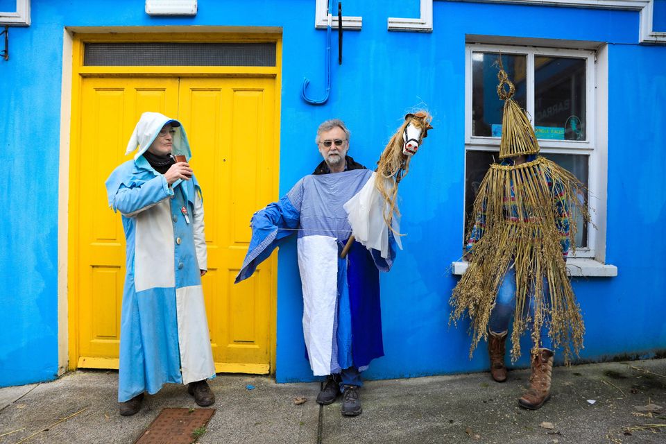 Sráide Eoin: Declan Malone (left),  Pat Doyle (Hobby Horse) and Grace O’Malley,  standing by waiting for the Wren to begin. Lá an Dreoilín or Wren Day is a very old tradition particularly in the Dingle Peninsula. Photo by Valerie O'Sullivan. 