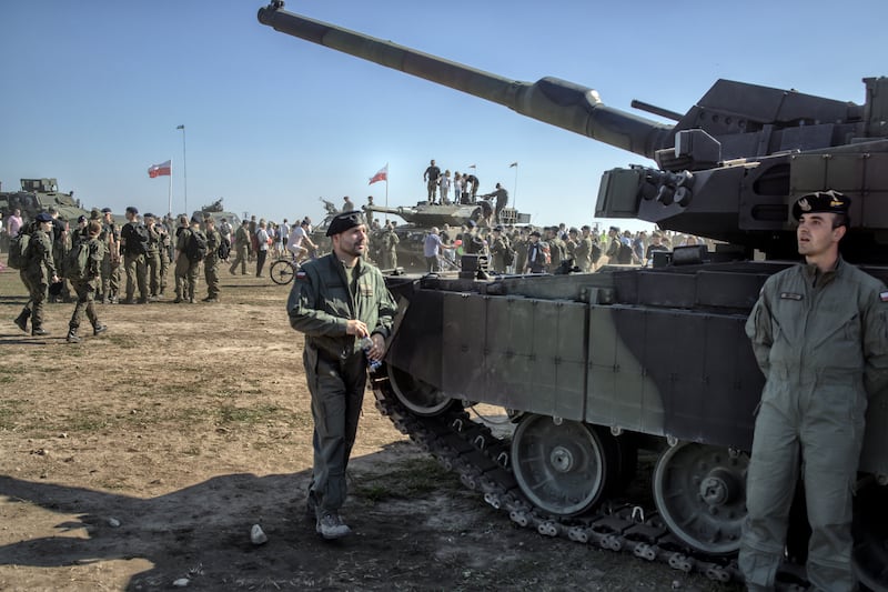A military show in Bemowo Piskie, Poland, showcasing advanced weapons. Photograph: Maciek Nabrdalik/The New York Times
                      