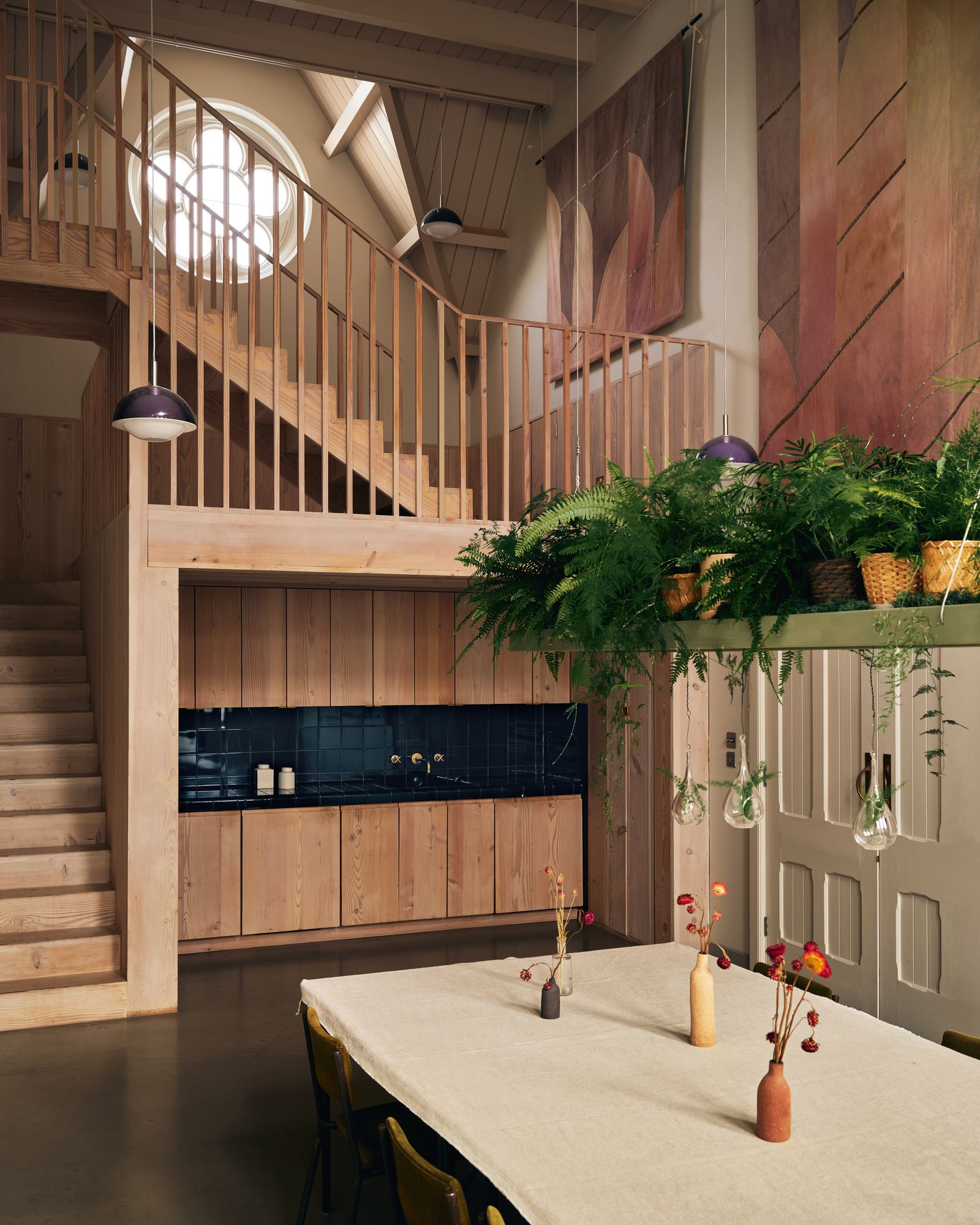 In the meeting hall a doubleheight hall kitchen and meeting area respects the soaring space of the original mission...