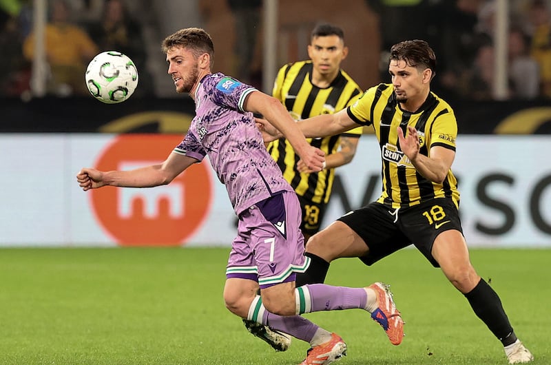 Shamrock Rovers's Dylan Watts in action against AEK Athen's Razvan Marin. Photograph: Inpho