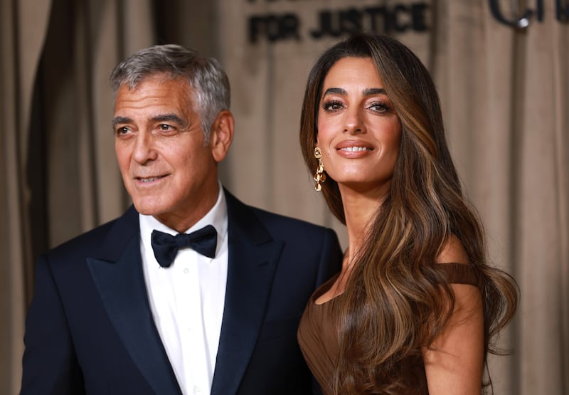 Clooney Foundation for Justice: George Clooney with his wife, Amal, at their organisation's awards ceremony in London in October. Photograph: Neil Hall/EPA