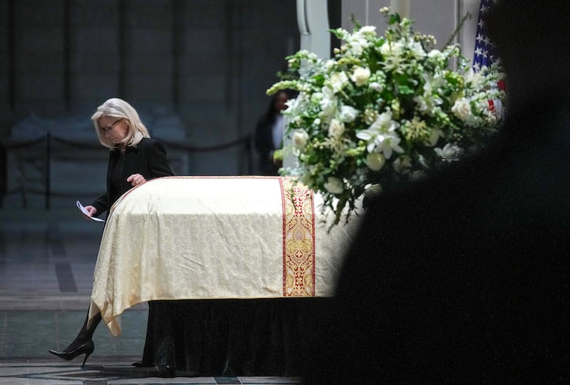 Liz Cheney, the daughter of Dick Cheney, walks past her father's casket at the funeral service on Thursday. Photograph: Andrew Harnik/Getty Images