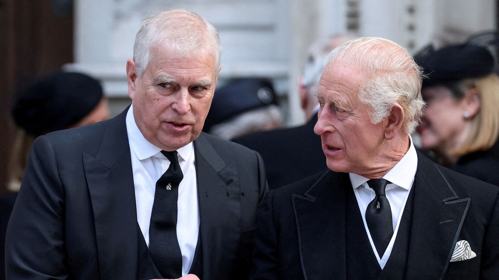 Britain's former Prince Andrew speaks with King Charles as they leave Westminster Cathedral at the end of the Requiem Mass, on the day of the funeral of Katharine, Duchess of Kent, in London, September 16, 2025.