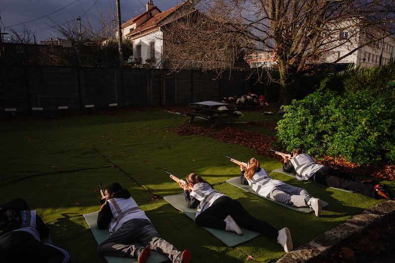 Participants use laser rifles during France's "defense and citizenship day" in Paris earlier this week. Photograph: Dimitar Dilkoff/AFP/Getty Images